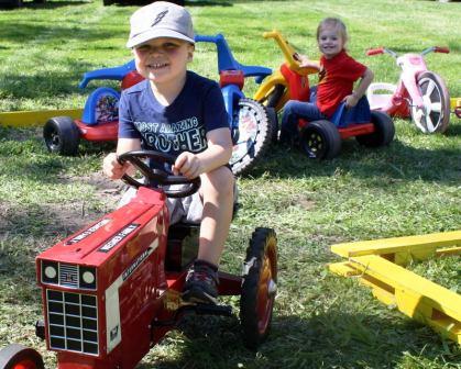 Kids Riding a Tractor at the Thresheree & Harvest Festival